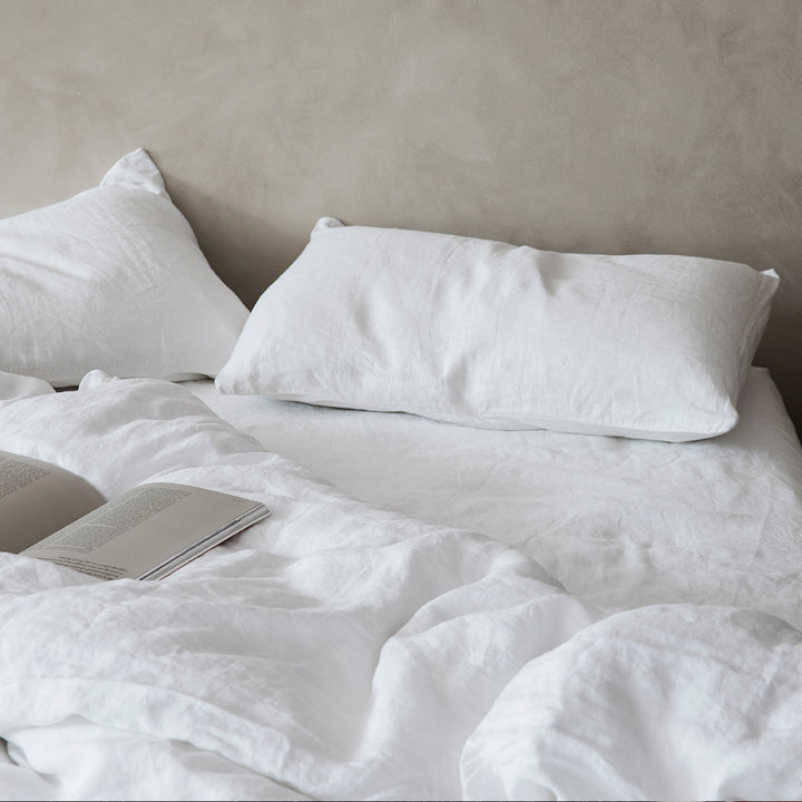 A bed dressed in White bedlinen.. Sizes: Queen, King, California King