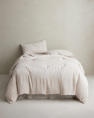 Cultiver natural linen duvet cover styled on a bed, showcasing soft, breathable bed linen for a relaxed, elegant bedroom look.
