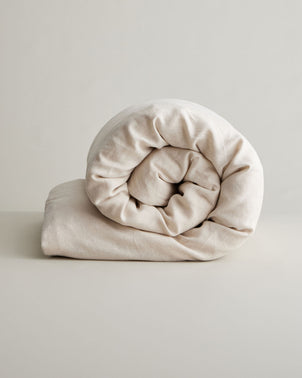 Natural linen duvet cover by CULTIVER, showcasing soft, breathable bed linen with a neutral, natural color and textured fabric.