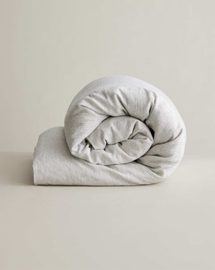 Linen duvet cover with pinstripe pattern from CULTIVER, showing a neatly made bed with the stylish bed linen.