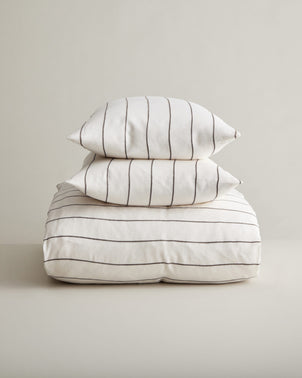 Linen duvet cover set with truffle stripe pattern from CULTIVER, featuring a cozy, stylish bed linen design.