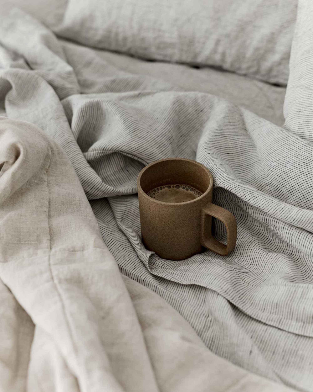 Set of 2 CULTIVER linen Euro pillowcases with classic pinstripe design, soft and breathable bed linen for a stylish bedroom look.