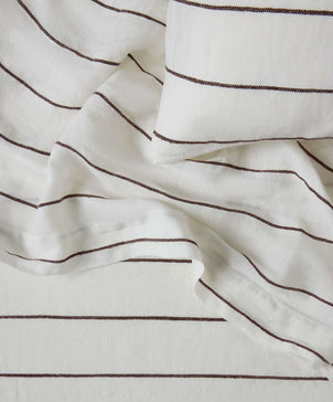 Close-up of white fabric with brown stripes