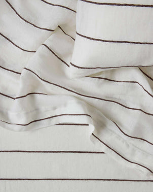 Cultiver complimentary swatch card featuring Truffle Stripe fabric sample with beige and brown striped pattern.