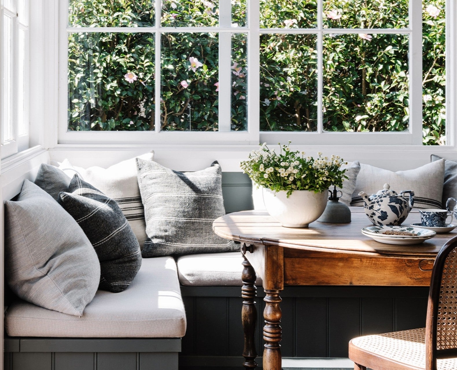 Cushions around a coffee table.