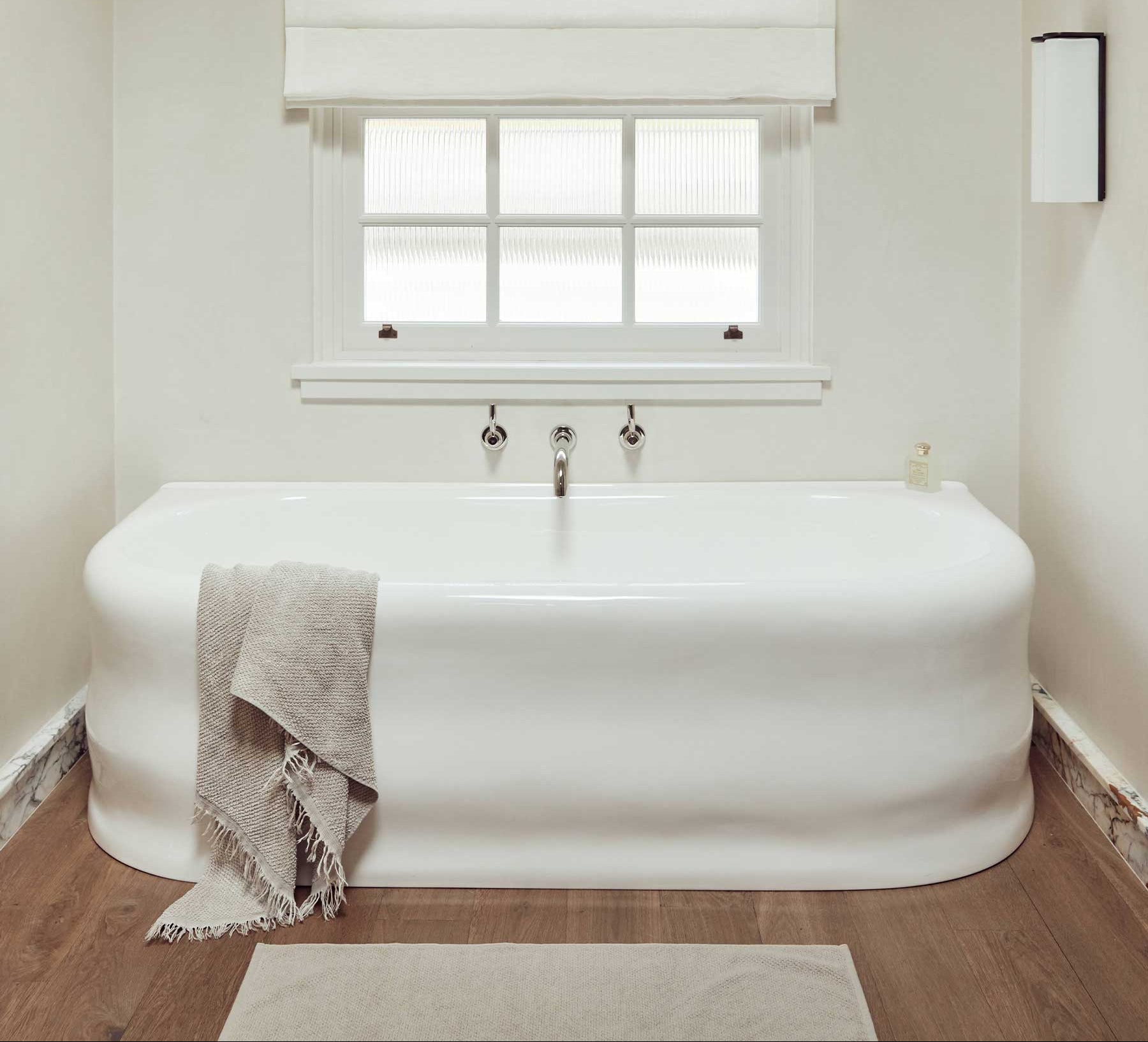 Bed with brown bedding and headboard in a bedroom setting
