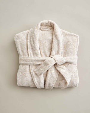 Folded CULTIVER woven speckle cotton robe displayed flat, showcasing its soft, textured fabric and relaxed fit.