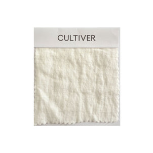 A square ivory linen swatch with a subtle texture, attached to a card labeled CULTIVER—perfect for previewing the look and feel of the Complimentary Swatch - Ivory at home before you buy.