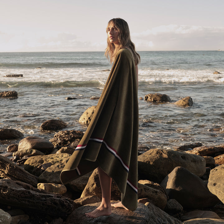 A woman with a Beach Towel in Olive