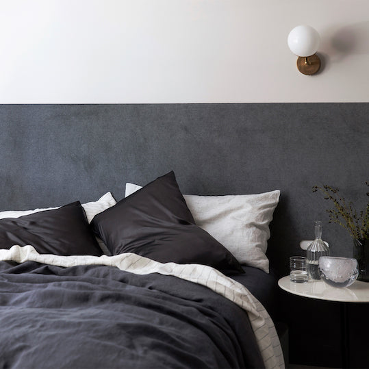A bed dressed in Slate, Pinstripe and Smoke Grey Linen