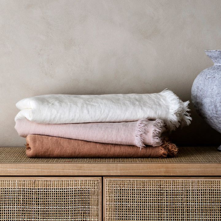 Stack of Freya Linen Throws in Snow, Blush and Fawn