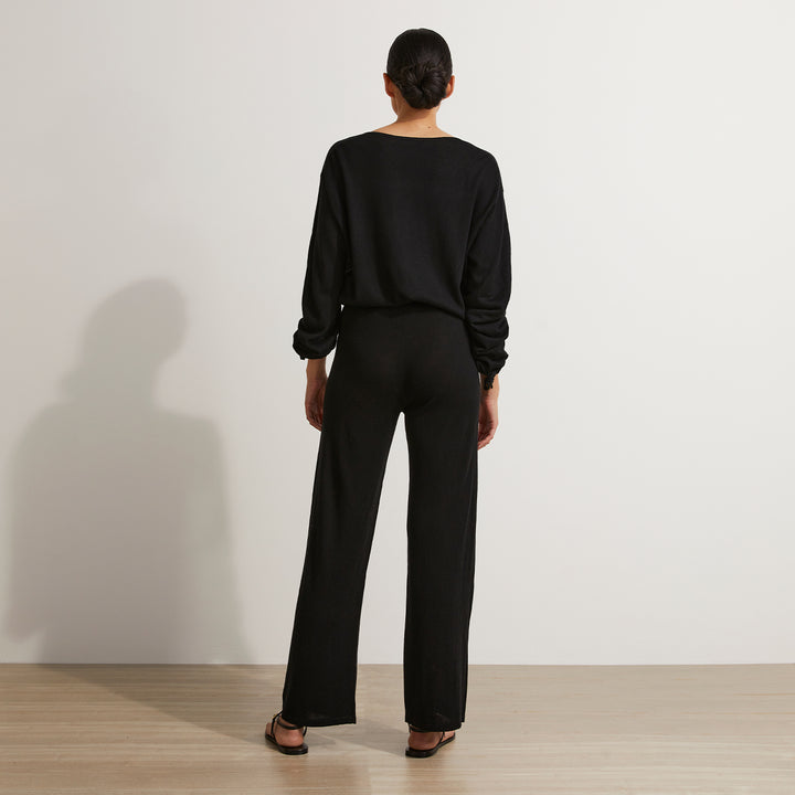 A back on shot of a model wearing the Ada Knitted Pants and Long Sleeve Top in Black