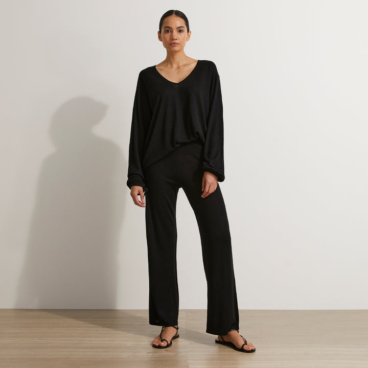 A front on shot of a model wearing the Ada Knitted Pants and Long Sleeve Top in Black