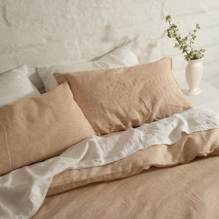 A cropped photo of a bed dressed in Cinnamon and White bed linen. Sizes: Queen, King