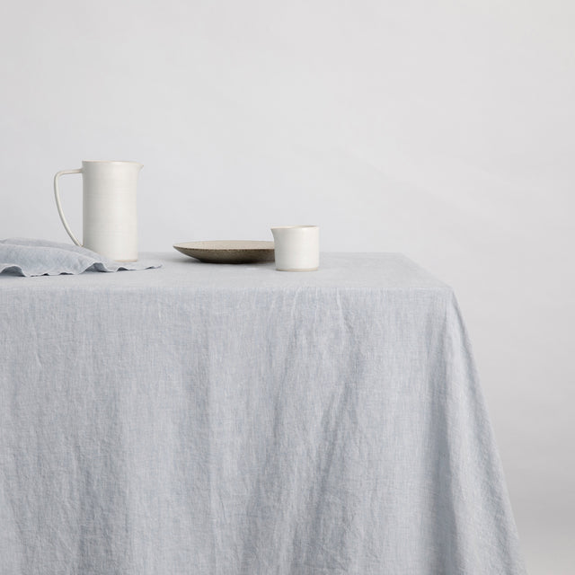 Linen Tablecloth in Sky with ceramics placed on top