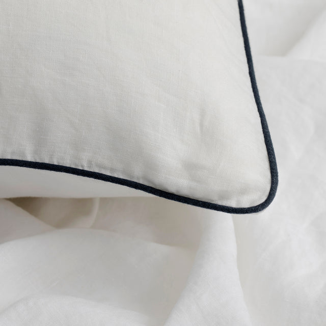 Close up of Piped Linen Euro Pillowcase in White and Navy