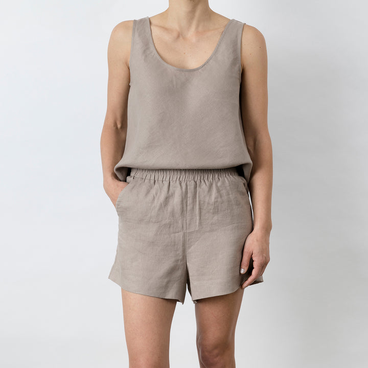 Front view of Piper Linen Short in Clay. Model is also wearing the matching Piper Linen Singlet in Clay.