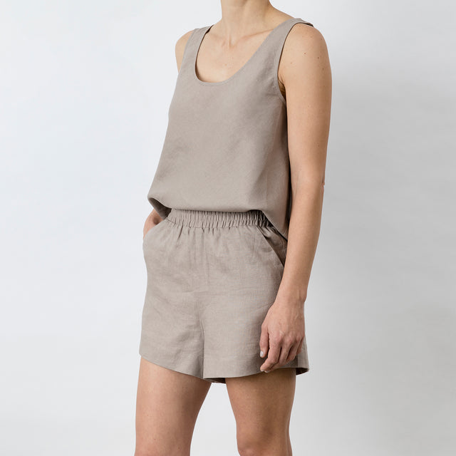 Side view of Piper Linen Short in Clay. Model is also wearing the matching Piper Linen Singlet in Clay.