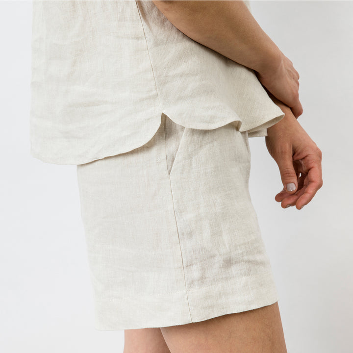 Close up of the Piper Linen Singlet in Natural. Model is also wearing the matching Piper Linen Short in Natural.
