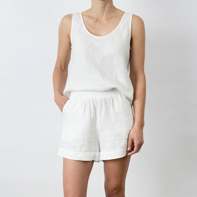 Front view of Piper Linen Short in White. Model is also wearing the matching Piper Linen Singlet in White.
