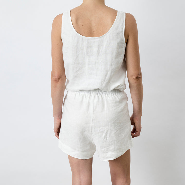 Back view of Piper Linen Short in White. Model is also wearing the matching Piper Linen Singlet in White.