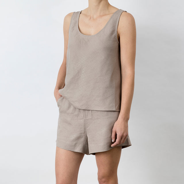 Side view of Piper Linen Singlet in Clay. Model is also wearing the matching Piper Linen Short in Clay.