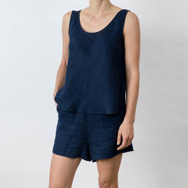 Side view of Piper Linen Singlet in Midnight. Model is also wearing the matching Piper Linen Short in Midnight.