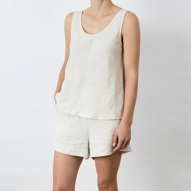 Side view of Piper Linen Singlet in Natural. Model is also wearing the matching Piper Linen Short in Natural.
