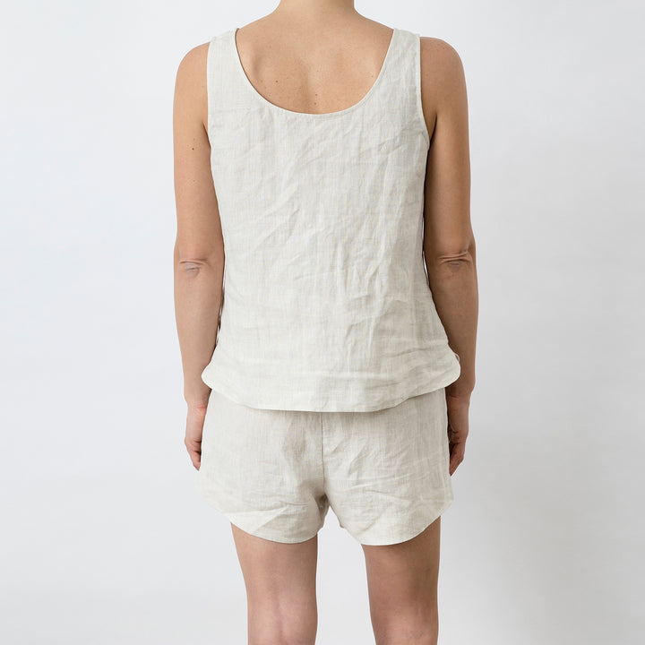 Back view of Piper Linen Singlet in Natural. Model is also wearing the matching Piper Linen Short in Natural.