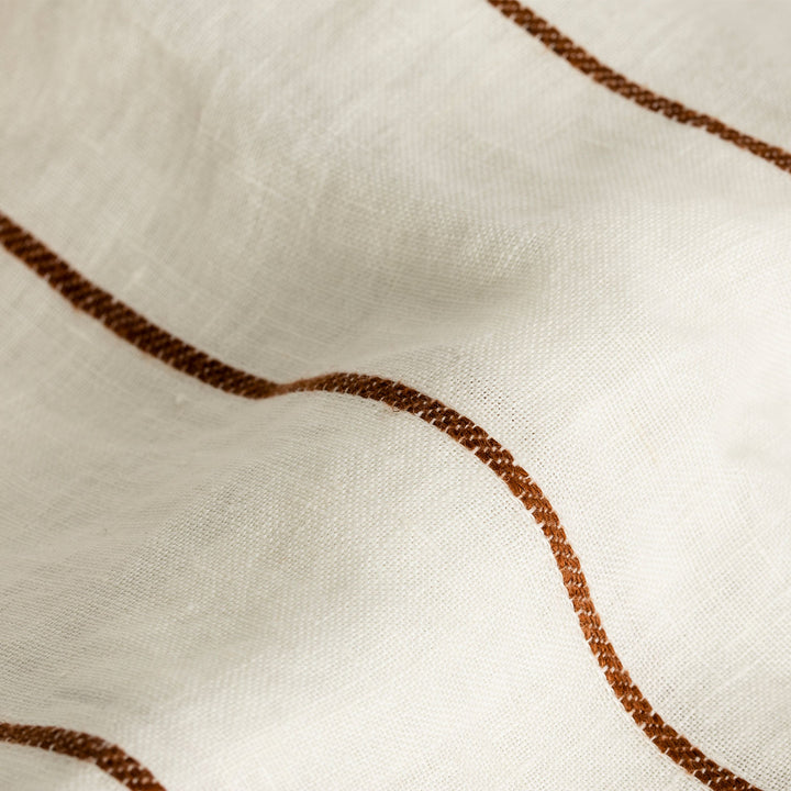 A close up of Cedar Stripe linen fabric. Sizes: Queen, King