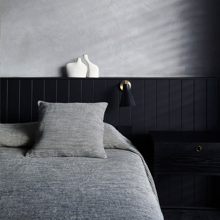 A bed styled with the Mira Linen Bedcover in Ellis Stripe